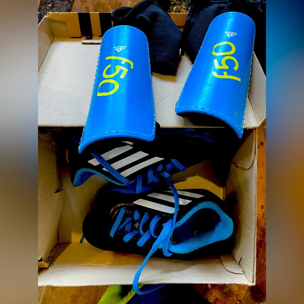 Adidas soccer cleats and shin guards